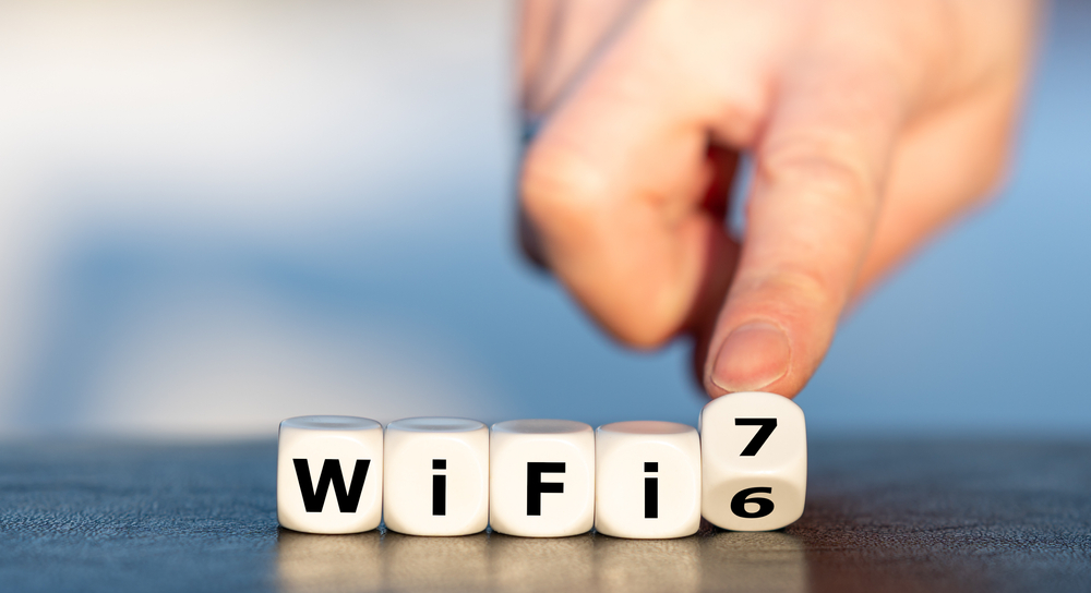 Hand Turns Dice and Changes the Expression "Wi-Fi 6" to "Wi-Fi 7"